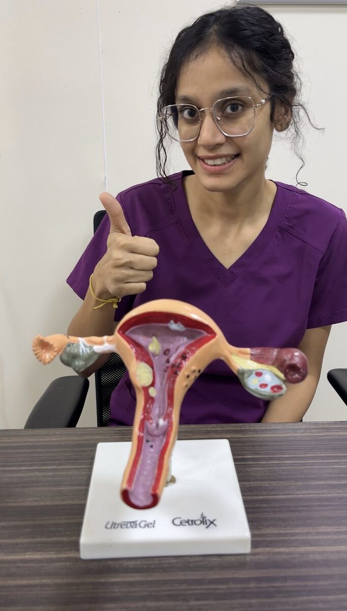 Dr. Chandini Sree Lalitha Chinta explaining reproductive anatomy with a teaching model
