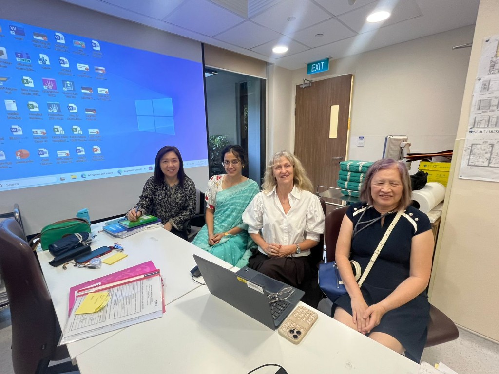 Dr. Chandini Chinta in clinical discussion with colleagues at Singapore General Hospital during her reproductive medicine fellowship